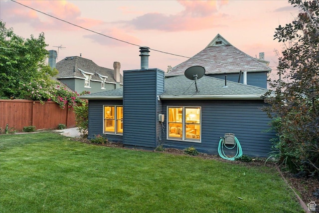 673 E 7th Ave, Salt Lake City, UT 84103 - back of house at dusk with a chimney and roof with shingles