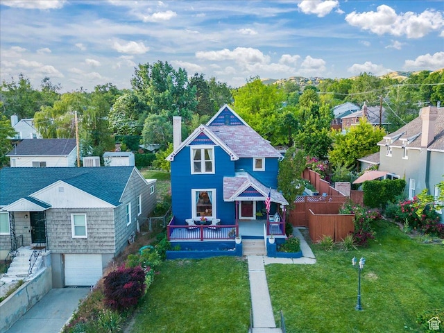 673 E 7th Ave, Salt Lake City, UT 84103 - victorian home with a chimney, a garage, and concrete driveway
