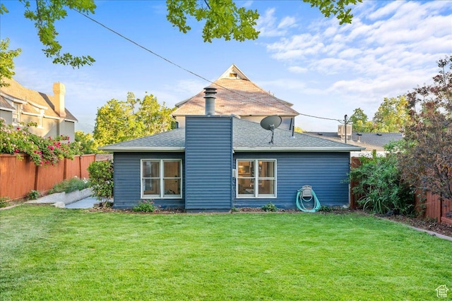 673 E 7th Ave, Salt Lake City, UT 84103 - rear view of property featuring a shingled roof and a chimney