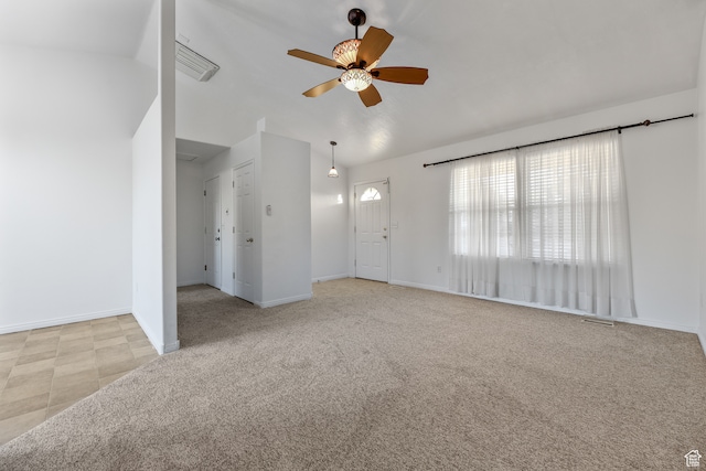 unfurnished living room with light carpet and ceiling fan