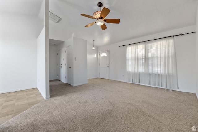 948 W 540th St S, Tooele, UT 84074 - unfurnished living room featuring a ceiling fan, lofted ceiling, baseboards, and carpet