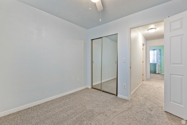 948 W 540th St S, Tooele, UT 84074 - unfurnished bedroom featuring light carpet, baseboards, a closet, and a ceiling fan