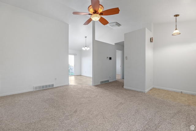 carpeted empty room featuring high vaulted ceiling and ceiling fan