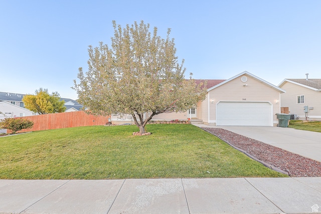 view of front of home with a garage and a front yard