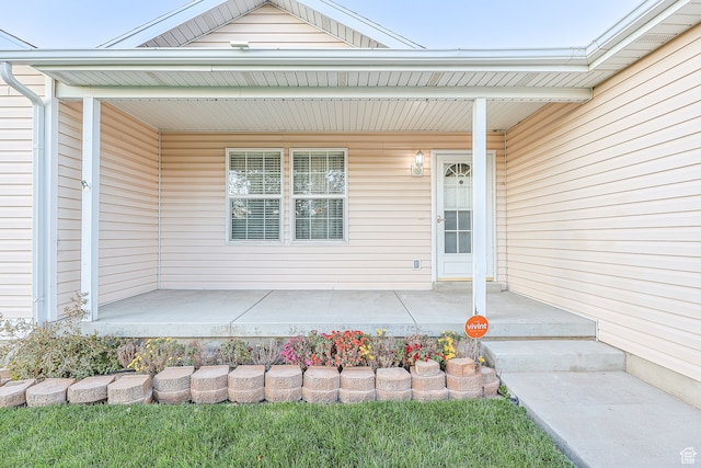 doorway to property featuring covered porch