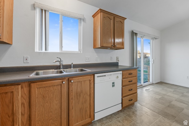 kitchen featuring white dishwasher, a healthy amount of sunlight, and sink