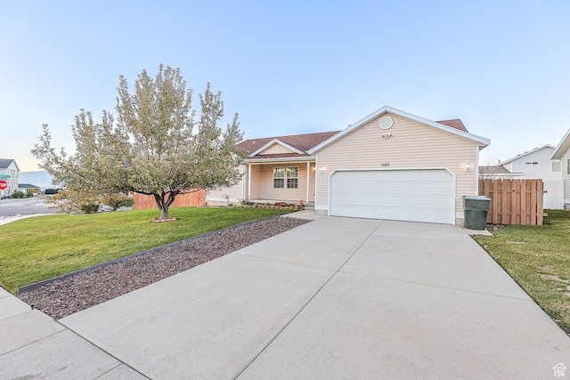 single story home with a front yard and a garage