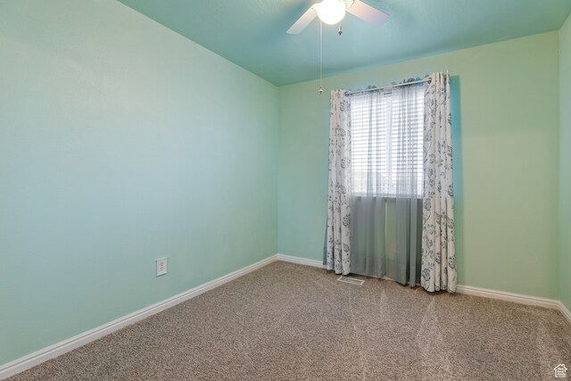 carpeted empty room with ceiling fan