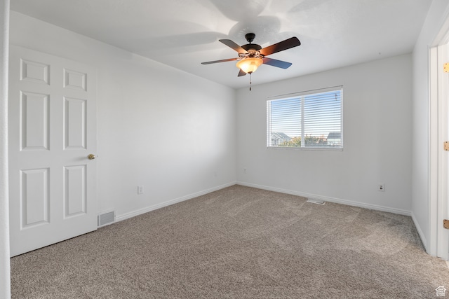 carpeted empty room with ceiling fan