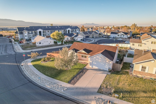 birds eye view of property with a mountain view