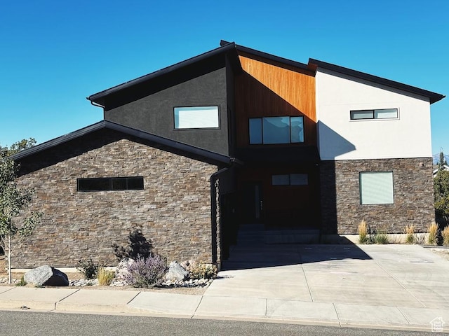 15224 S Tall Woods Dr, Draper Ut Cnty, UT 84020 - contemporary home with stone siding, driveway, stucco siding, and a garage