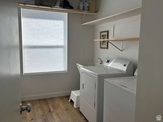 15224 S Tall Woods Dr, Draper Ut Cnty, UT 84020 - washroom featuring washer and dryer, plenty of natural light, light wood-type flooring, and baseboards