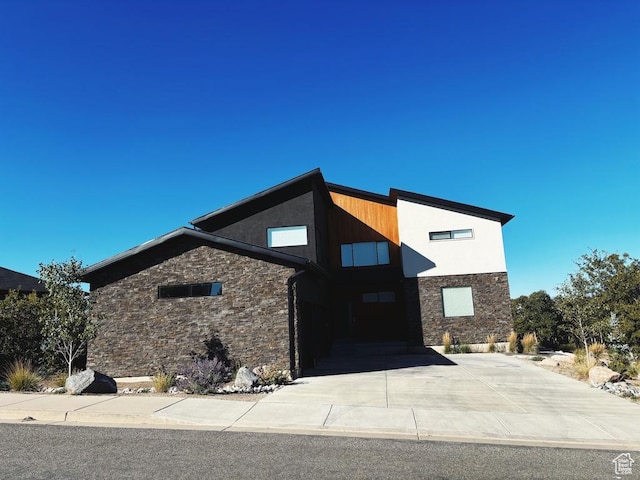 15224 S Tall Woods Dr, Draper Ut Cnty, UT 84020 - contemporary house featuring stone siding, driveway, and stucco siding