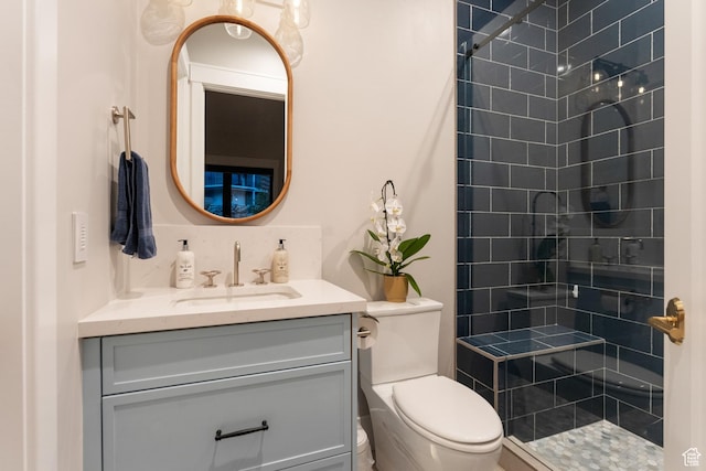 3300 E Hunters Ridge Cir, Heber City, UT 84032 - bathroom with a tile shower, vanity, and toilet