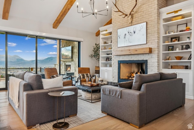 3300 E Hunters Ridge Cir, Heber City, UT 84032 - living area featuring a fireplace, a mountain view, light wood finished floors, beamed ceiling, and high vaulted ceiling