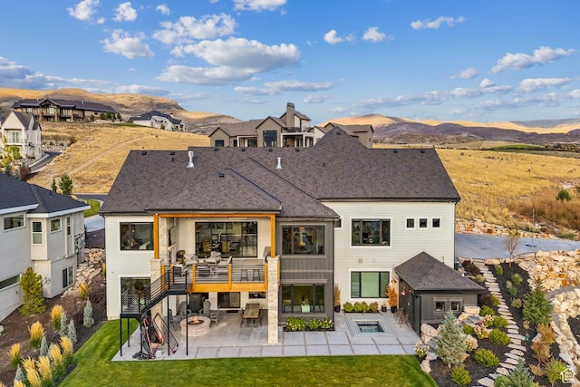 3300 E Hunters Ridge Cir, Heber City, UT 84032 - rear view of property with a patio area, a lawn, and a mountain view