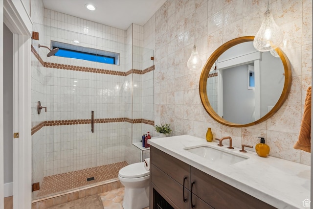 3300 E Hunters Ridge Cir, Heber City, UT 84032 - bathroom with tile walls, tiled shower, toilet, and vanity
