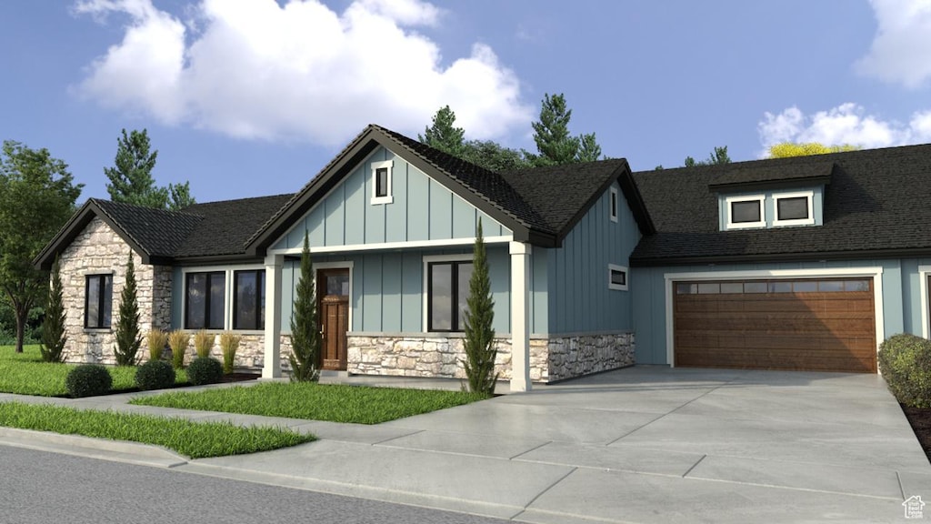 6087 W Parkway S Unit Skye, West Valley City, UT 84128 - view of front of property with stone siding, driveway, board and batten siding, and roof with shingles