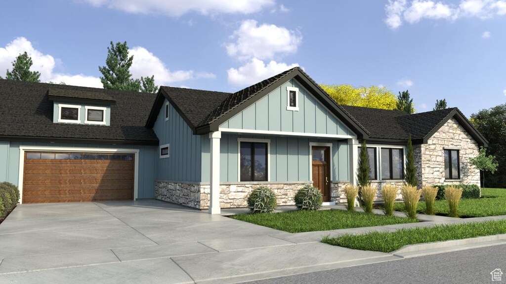 6087 S Parkway Ave # Maxton, West Valley City, UT 84120 - view of front of property featuring stone siding, an attached garage, driveway, and roof with shingles