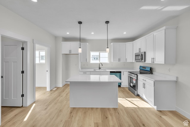 7901 S 2700 E Unit 203, South Weber, UT 84405 - kitchen featuring stainless steel appliances, light wood-style flooring, baseboards, and a sink