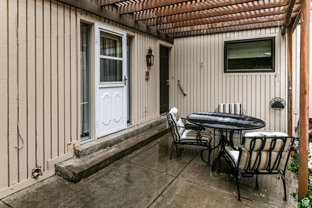 6435 S 1610 E, Murray, UT 84121 - view of patio featuring a pergola, outdoor dining area, and entry steps