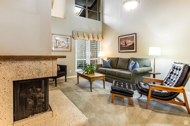 6435 S 1610 E, Murray, UT 84121 - living room with carpet, plenty of natural light, baseboards, a towering ceiling, and a multi sided fireplace