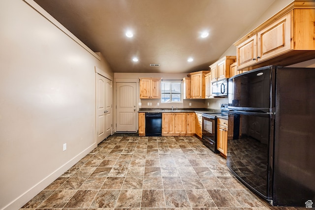 kitchen featuring light brown cabinetry, black appliances, vaulted ceiling, and sink