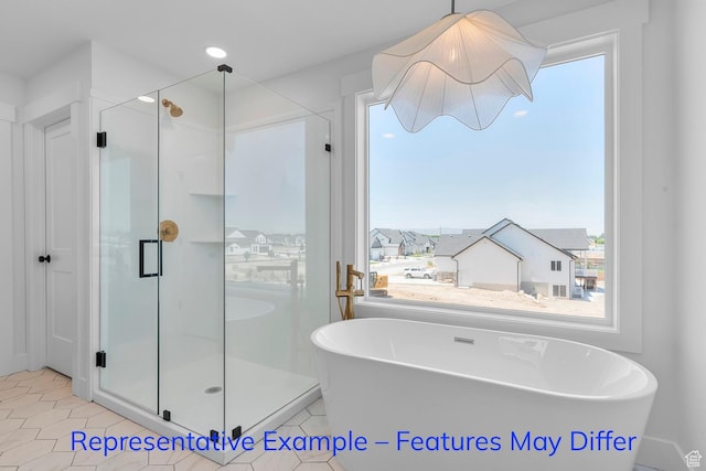 3689 S Riverstone Rd, Mapleton, UT 84664 - bathroom featuring a stall shower, a freestanding bath, and tile patterned flooring