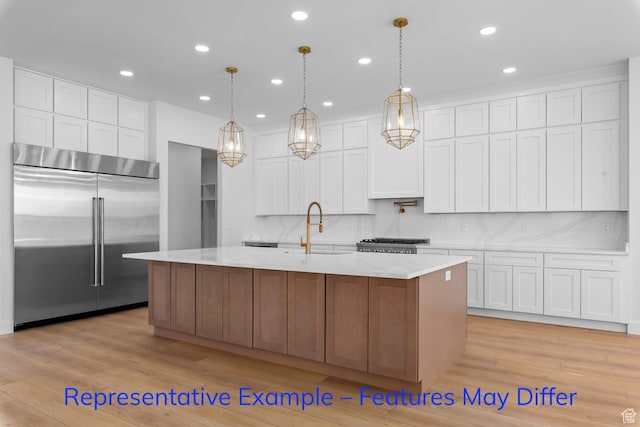 3689 S Riverstone Rd, Mapleton, UT 84664 - kitchen featuring built in refrigerator, a sink, range, light wood-style flooring, and recessed lighting