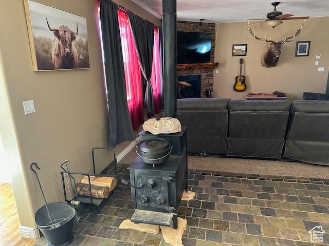 3741 W 5200 N, Cedar City, UT 84721 - living room with ceiling fan, a fireplace, and baseboards