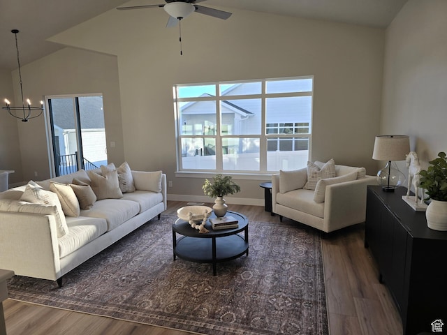 10798 S Haven Landing Dr, South Jordan, UT 84095 - living room featuring ceiling fan with notable chandelier, dark hardwood / wood-style floors, and lofted ceiling