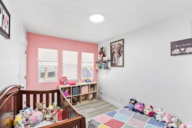 2034 S Laine Ave E, Ogden, UT 84401 - bedroom featuring wood finished floors and baseboards