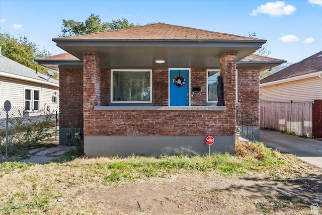 2034 S Laine Ave E, Ogden, UT 84401 - view of front of home with fence and brick siding
