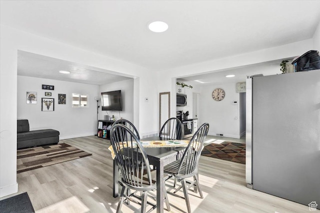 2034 S Laine Ave E, Ogden, UT 84401 - dining area featuring light wood-style flooring and baseboards