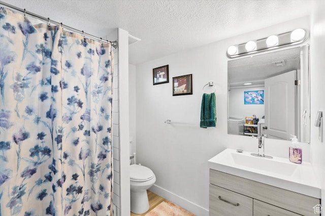 2034 S Laine Ave E, Ogden, UT 84401 - bathroom featuring a textured ceiling, toilet, vanity, curtained shower, and baseboards