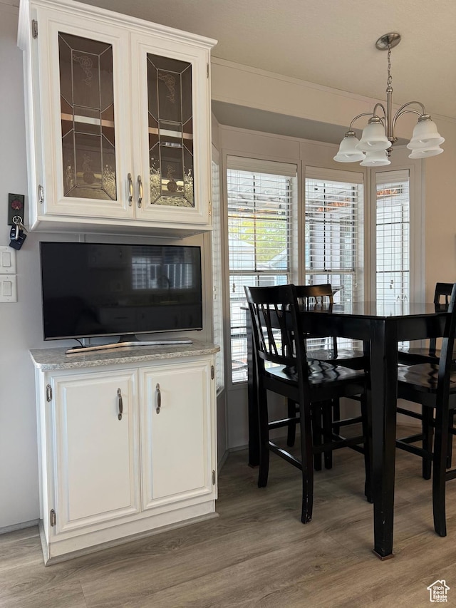 1150 W Red Hills Pkwy Unit 51, Washington, UT 84780 - dining space with a chandelier and light wood-style flooring