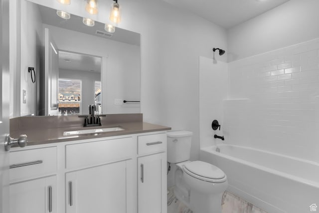 full bathroom with vanity, shower / bath combination, and toilet