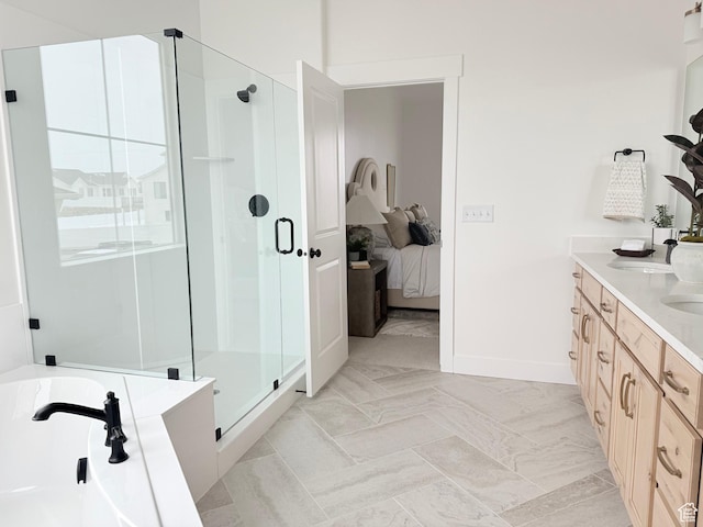 577 N Hawthorn Dr Unit 29, Salem, UT 84653 - ensuite bathroom with a shower stall, double vanity, a bath, baseboards, and marble finish flooring