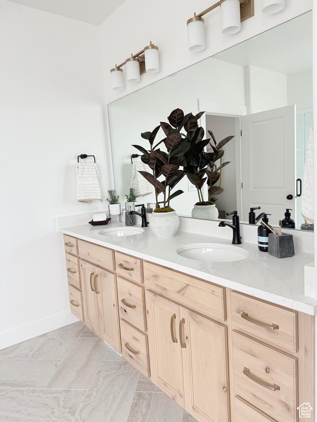 577 N Hawthorn Dr Unit 29, Salem, UT 84653 - full bathroom featuring double vanity and baseboards