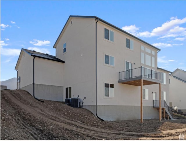 577 N Hawthorn Dr Unit 29, Salem, UT 84653 - back of property featuring a balcony, cooling unit, and stucco siding