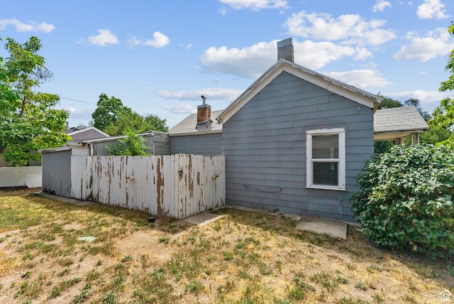 7865 S Main St, Midvale, UT 84047 - view of side of home featuring a yard