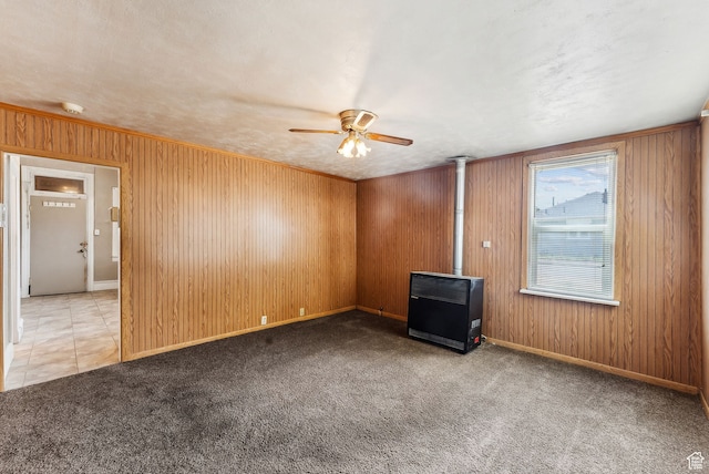7865 S Main St, Midvale, UT 84047 - empty room with ceiling fan, heating unit, light colored carpet, a textured ceiling, and wooden walls