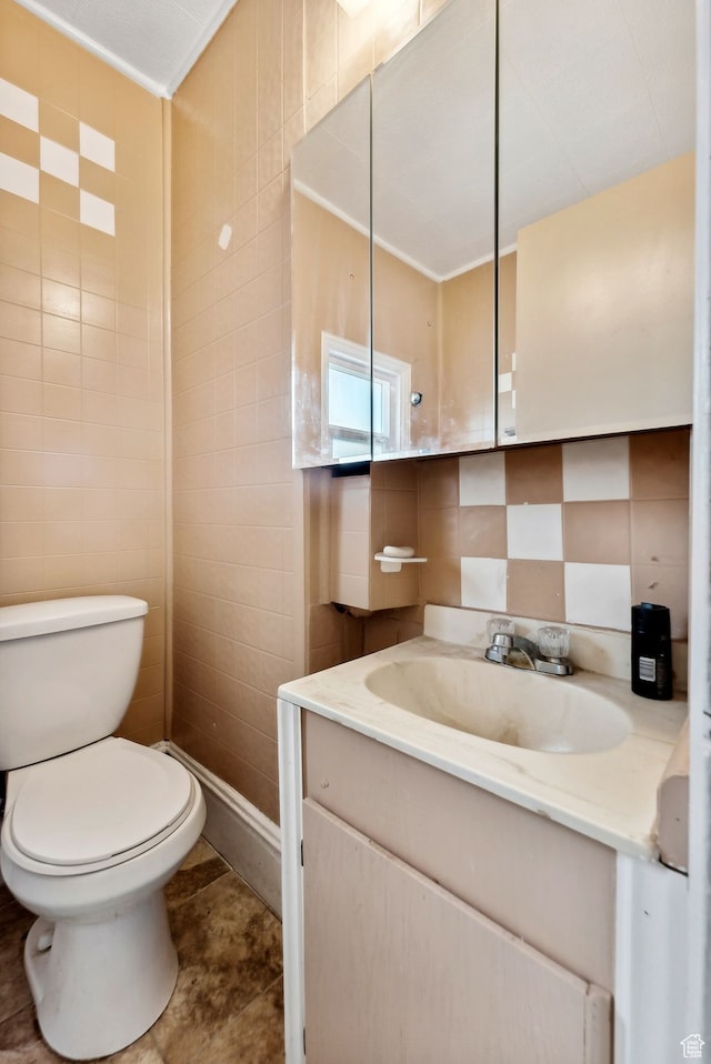 7865 S Main St, Midvale, UT 84047 - bathroom with tile patterned flooring, vanity, tile walls, and toilet