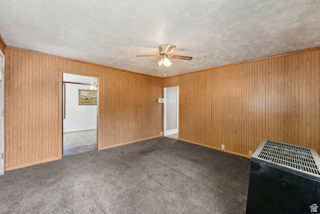 7865 S Main St, Midvale, UT 84047 - carpeted spare room with wooden walls, heating unit, ceiling fan, and crown molding