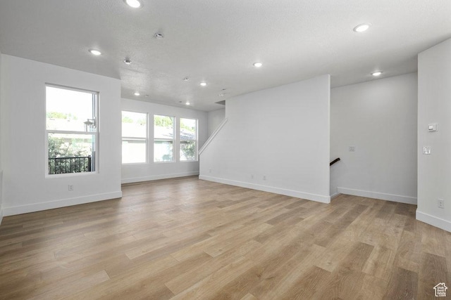 3475 S Perthshire Dr Unit 30, South Salt Lake, UT 84115 - spare room featuring recessed lighting, baseboards, and light wood finished floors