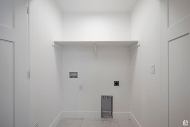 3475 S Perthshire Dr Unit 30, South Salt Lake, UT 84115 - washroom with baseboards, washer hookup, hookup for an electric dryer, and light marble finish flooring
