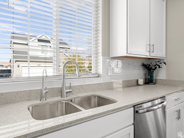 2424 N Lazy J Ln, Lehi, UT 84043 - kitchen with light stone counters, white cabinetry, stainless steel dishwasher, and sink