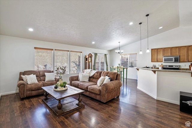 living area with recessed lighting, vaulted ceiling, and a healthy amount of sunlight
