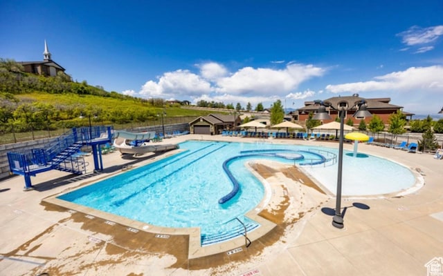 2159 E Bald Eagle Ct S, Draper, UT 84020 - community pool featuring a patio area and fence