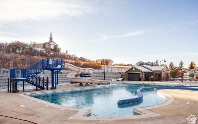 community pool with a water slide